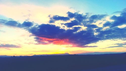 Low angle view of dramatic sky during sunset