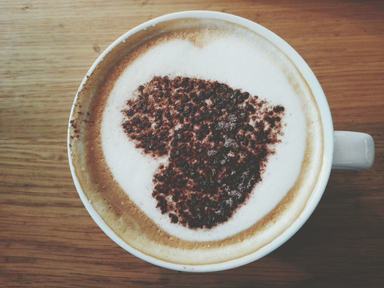 food and drink, indoors, drink, freshness, table, refreshment, coffee cup, still life, coffee - drink, food, directly above, high angle view, frothy drink, close-up, sweet food, saucer, healthy eating, coffee, no people, cup