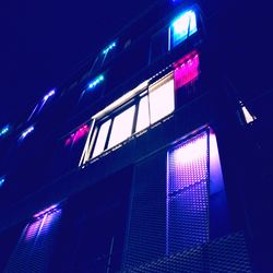 Low angle view of illuminated building at night