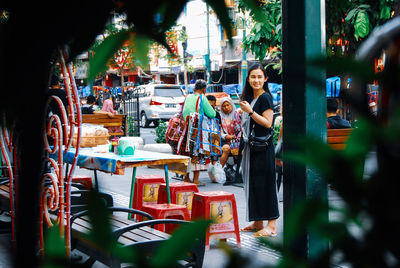 Woman standing at market stall