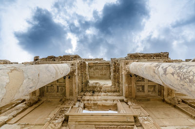 Low angle view of historical building against cloudy sky