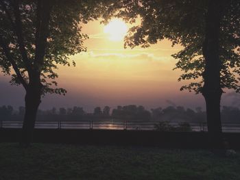 Scenic view of landscape against sky at sunset