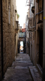 Narrow alley amidst buildings