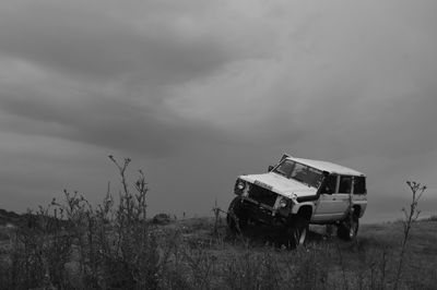 Tractor on field against sky