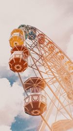 Low angle view of ferris wheel against sky