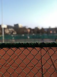 Close-up of chainlink fence against clear sky