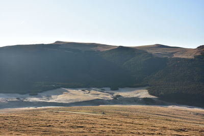 Scenic view of desert against clear sky