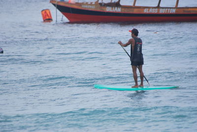 Man standing on paddleboard 