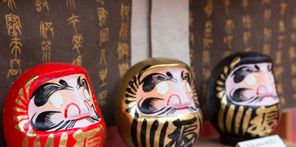 Close-up of figurine on wood