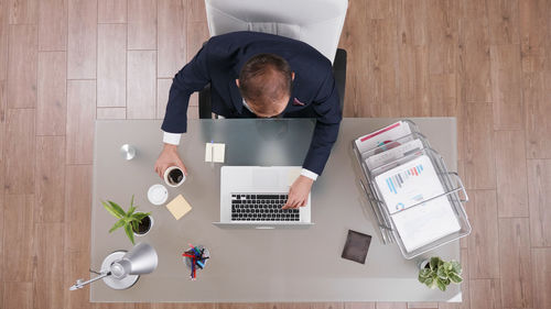 Directly above shot of man working on table