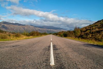 Surface level of road against mountain range