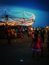 People enjoying at amusement park