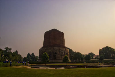Ruins of temple against clear sky during sunset