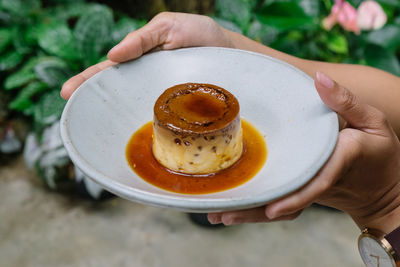 Midsection of person holding breakfast