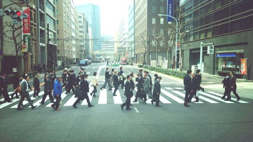 People walking on road in city