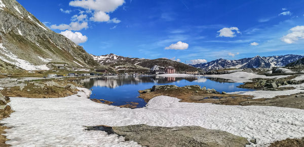 Ultra wide panorama of the lake in the gotthardpass with snow