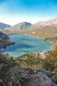 Scenic view of lake and mountains against sky