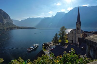 Panoramic view of lake and buildings against sky