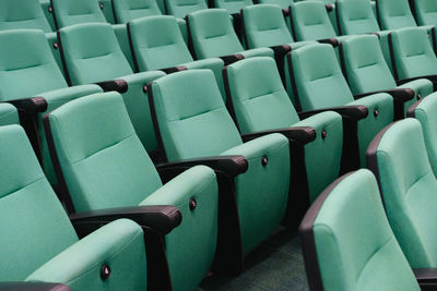 Full frame shot of green seats at auditorium