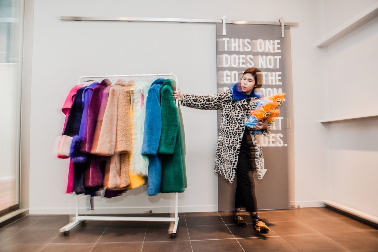 WOMAN STANDING IN A STORE