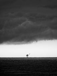 Storm clouds over the gulf of mexico with oil platform in the background 2