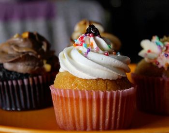 Close-up of cupcakes on cake