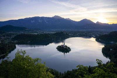 Scenic view of lake against sky during sunset