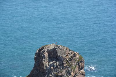 High angle view of rock formation by sea