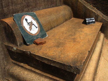 Warning sign on throne in historic building