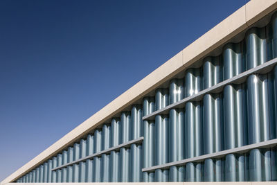 Low angle view of building against clear blue sky