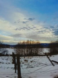 Scenic view of calm lake against sky