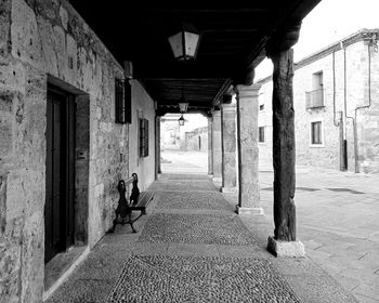 Man walking in corridor of building