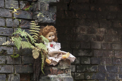 Full frame shot of child on stone wall