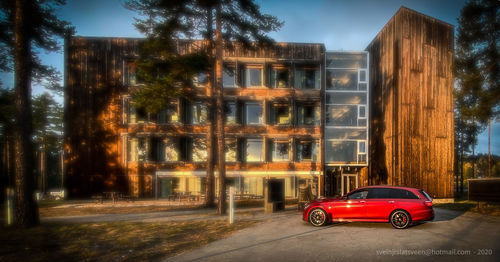 Cars on street by buildings in city