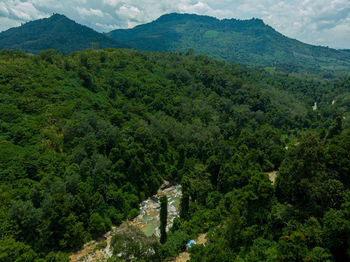 High angle view of green landscape and mountains