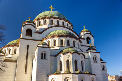 Low angle view of building against blue sky