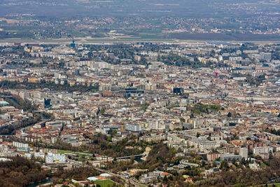 High angle shot of townscape against cityscape