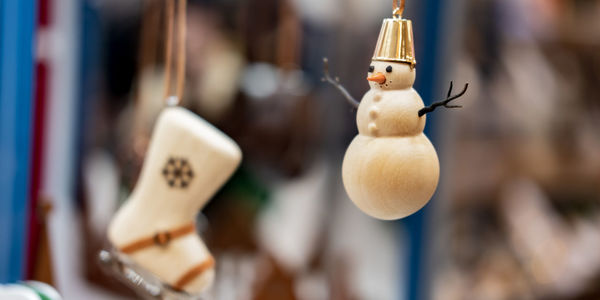 Close-up of stuffed toy hanging on wood