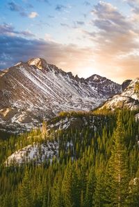 Scenic view of mountains against cloudy sky