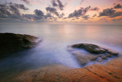 Idyllic view of sea against sky during sunset