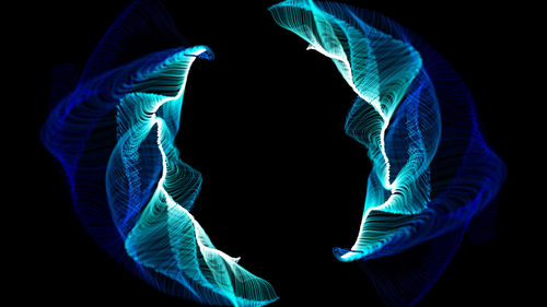 Multi colored umbrella against black background