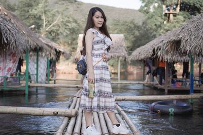 Portrait of woman standing in water