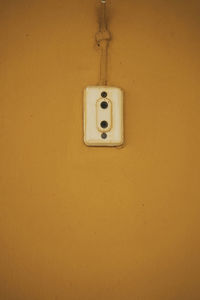 Close-up of electric lamp on wall