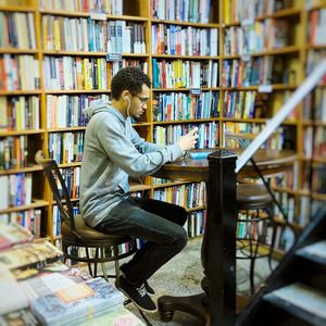 Young man reading book