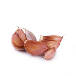 Close-up of garlic against white background