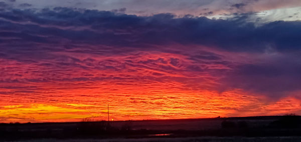 Scenic view of dramatic sky during sunset