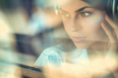 Close-up of young woman taking selfie