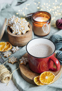 Cozy winter and christmas setting with hot cocoa and homemade cookies