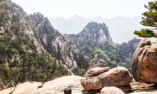 Rocks on mountain against sky