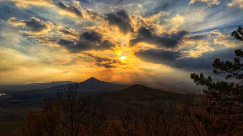 Scenic view of mountains against sky during sunset